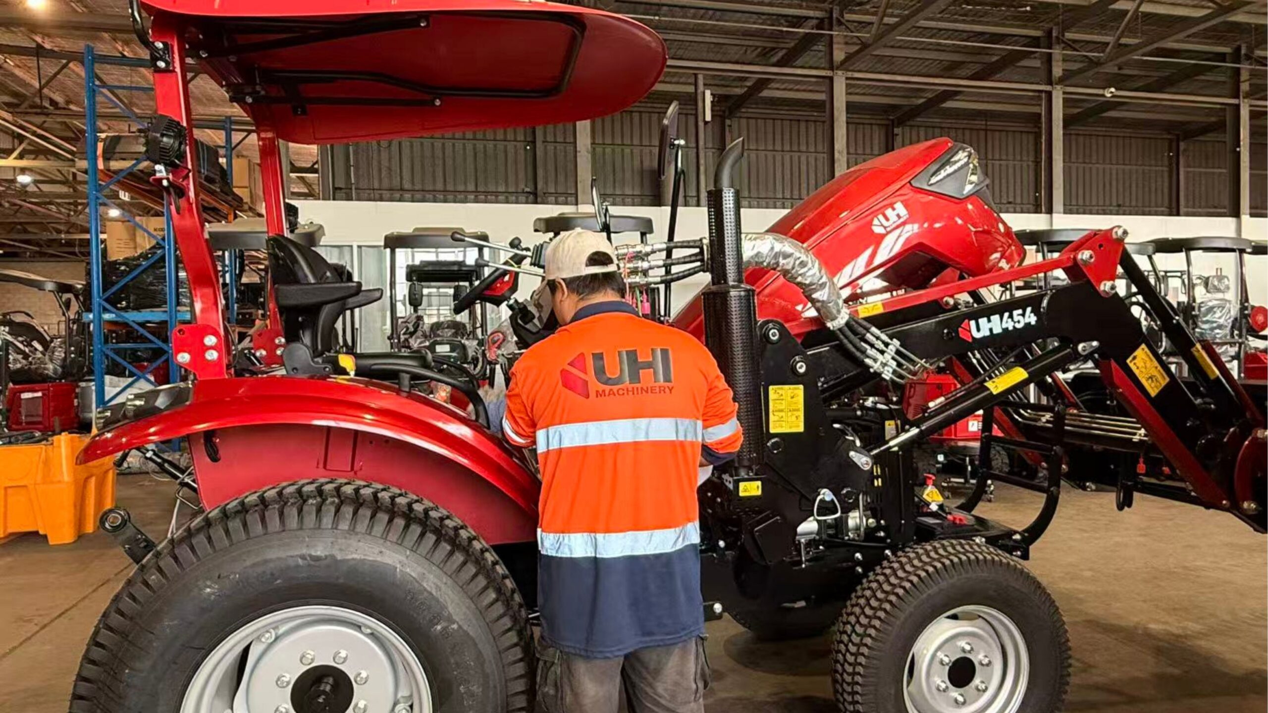 UHI technician inspecting construction machinery for warranty support