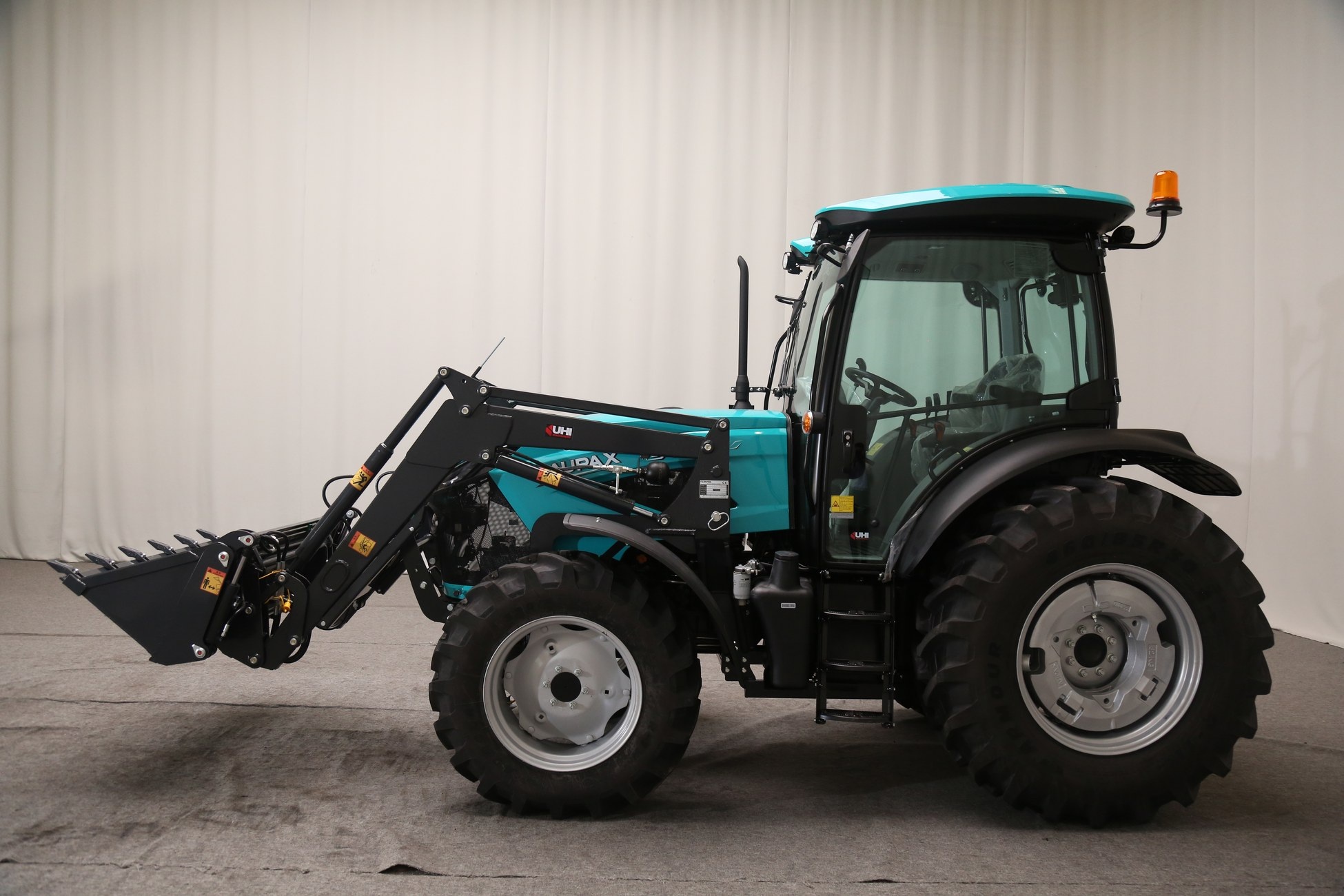 AUPAX 4090-H tractor in studio with loader